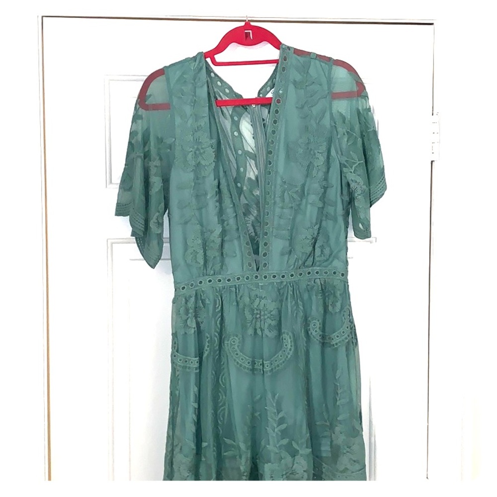 Romper with beautiful back low v neck!